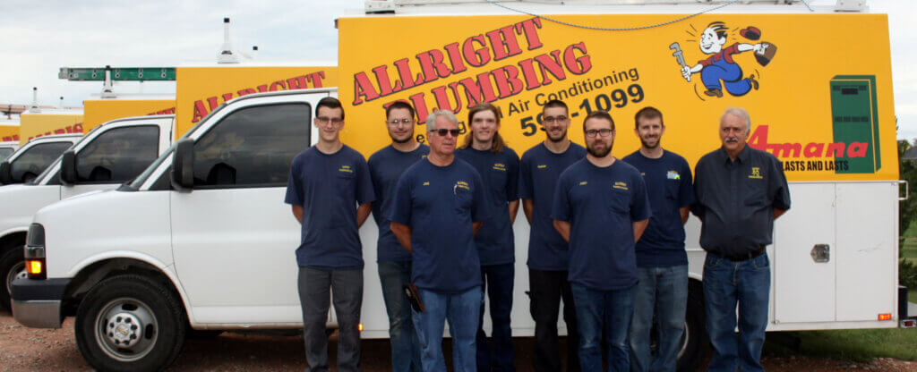 The best plumbers in Colorado Springs. Allright Heating & Plumbing Team in front of their fleet of trucks in Colorado Springs